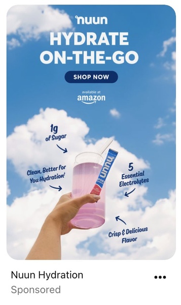 A vertical ad showcasing a hand holding a glass of electrolyte drink against a bright blue sky, using clear call-out arrows to highlight product benefits.